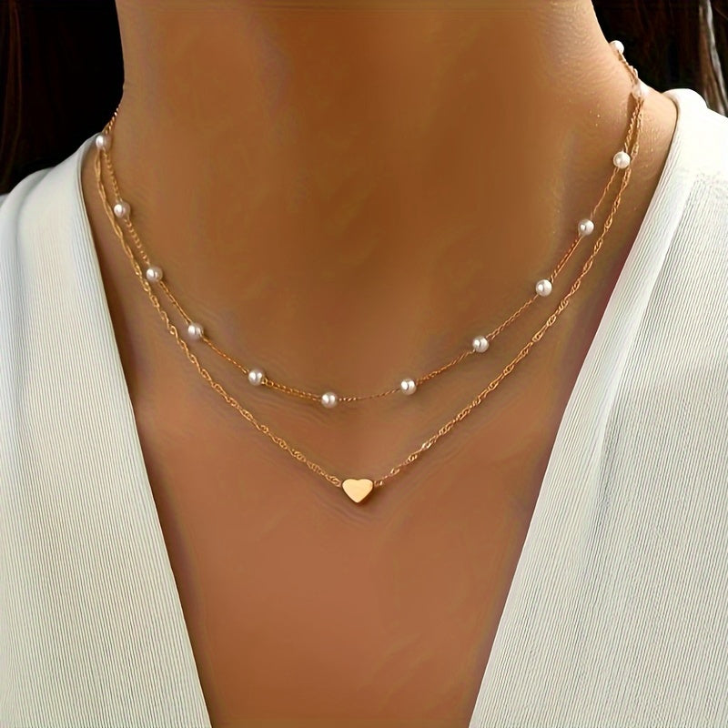 Collar doble con perlas y colgante de corazón