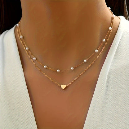Collar doble con perlas y colgante de corazón